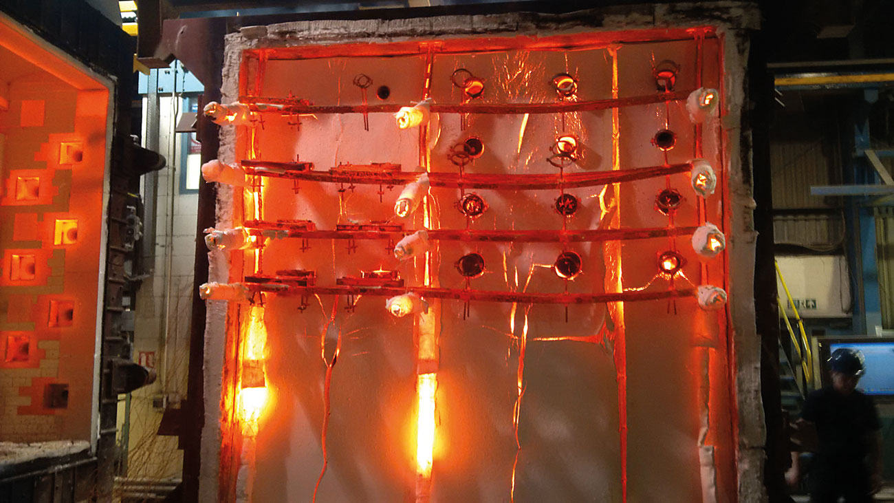 Fire test of firestopping products installed around service penetrations through a fire compartment wall.
