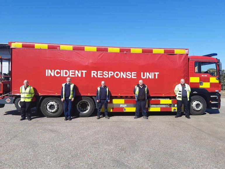 NFRS staff assisting with moving medical supplies. (NFRS)