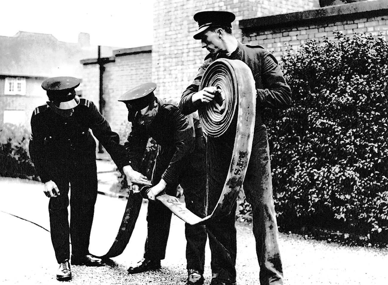 More recruitment and improved training was a major aim of the NFS, along with standardised equipment, one chain of command, uniforms, rank markings and conditions of service. Here a recruit is getting to grips with basic hose running.