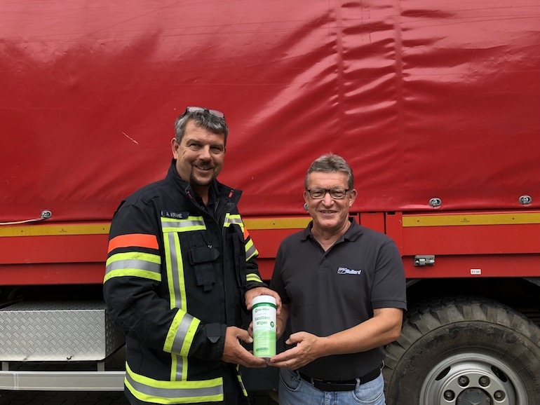 Alexander Krahe (left), Chief Fire Chief and Chairman of the Ahrweiler District Fire Brigade Association, met with Hans Alfter (right), Managing Director of Bullard GmbH, to receive the donation of De-Wipe disinfectant wipes organized by Bullard for further distribution. (Bullard)