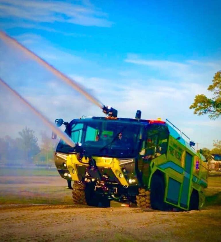 An ARFF (Aircraft Rescue & Firefighting) vehicle shown in action. (Photo by William Greenwood)