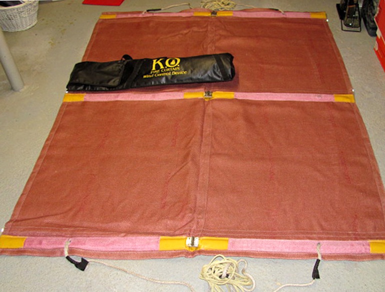 The 'F' Type fire curtain unrolled with bag. (K.O. Fire Curtain)