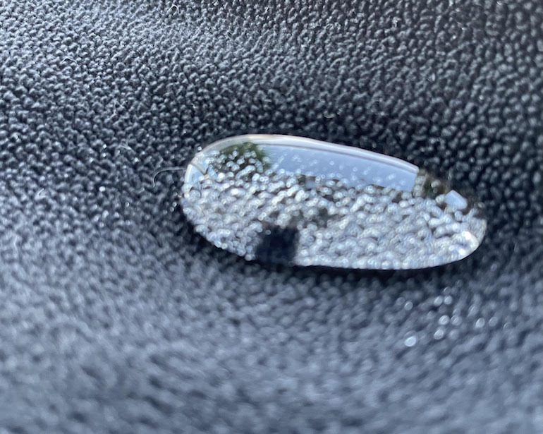 The same properties that make PFAS bioaccumulative and difficult to remediate is the strong fluorine bond demonstrated here showing water beading up off a water-repellant treated textile. (FEC)