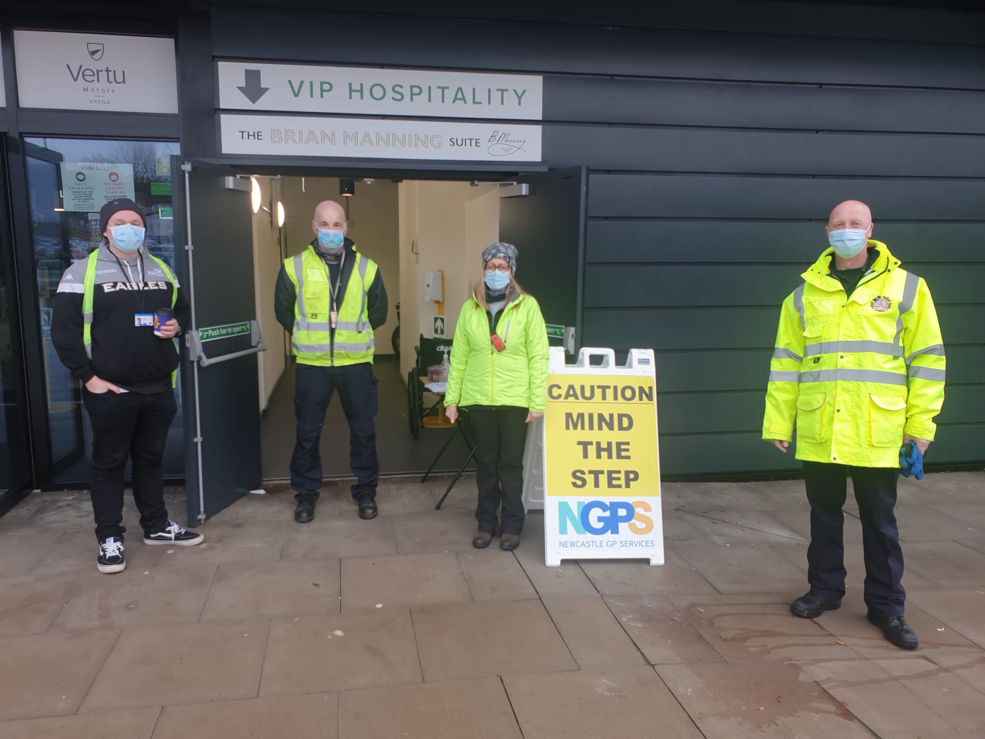 FF Mark Hayes helped lead the standing up of the vaccination centre. He is pictured alongside other TWFRS volunteers. (TWFRS)