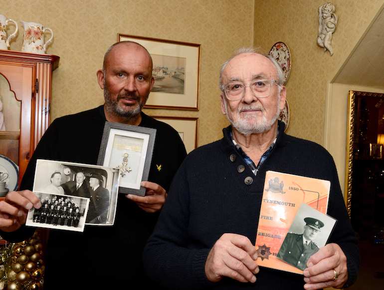 Scott Andrews and Wilf Andrews with various pictures and memorabilia. (Andrews Family)