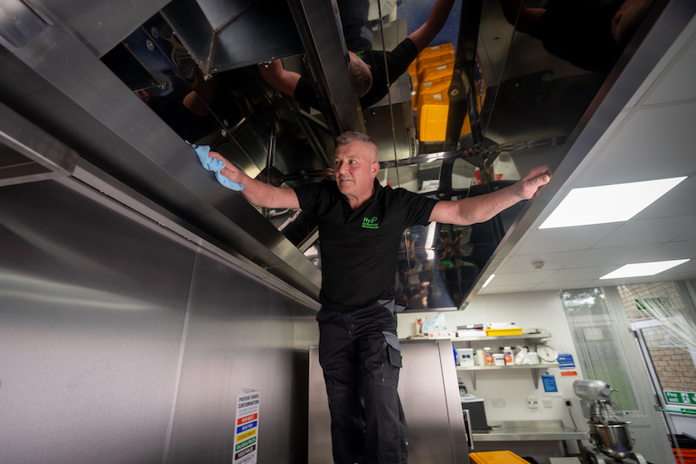 Hy5 Commercial Cleaning’s Managing Director Keith Simm cleans a kitchen extraction system to BESCA VHE standards. (Hy5 Commercial Cleaning)