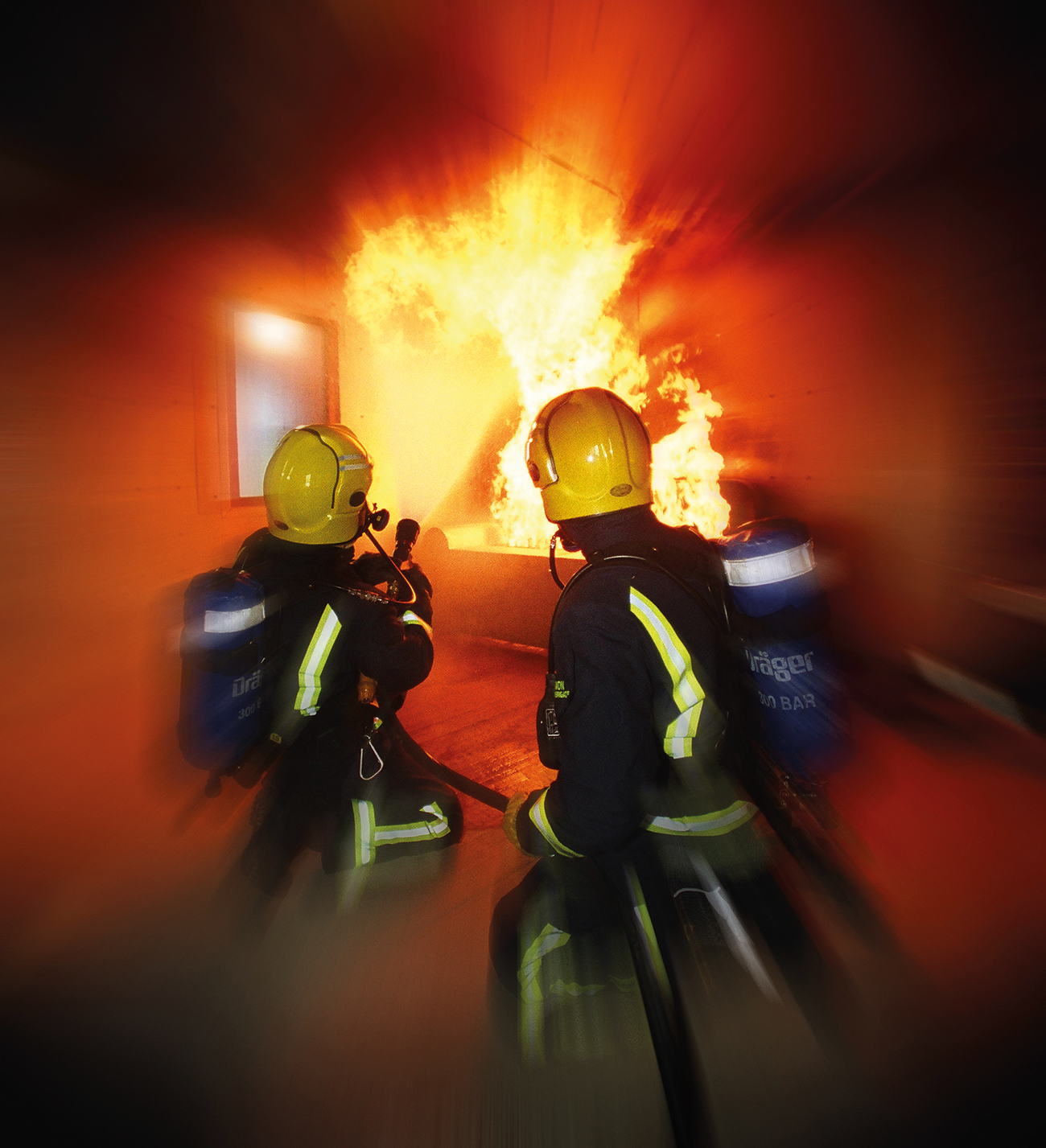 Two firefighters tackle a realistic training scenario in a settee at the Firefighter Training Unit at Avonmouth. Images supplied by Author / Contributor