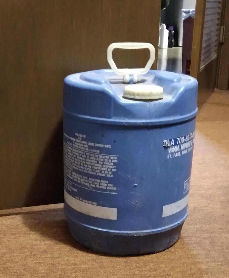 Propping a door open would not be considered a good use of an AFFF pail. (FEC)