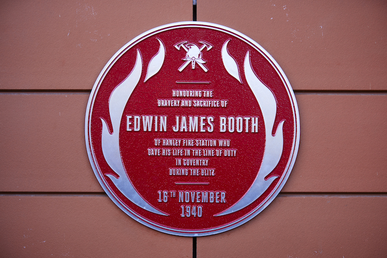 The red plaque memorial for Edwin James Booth who gave his life in service during the Blitz in 1940. (Photo credit: Mark Waugh)