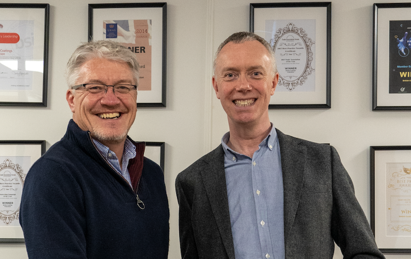 Outgoing ASFP CEO Steve Davies (left) congratulates new Managing Director Mike Ward. (ASFP)