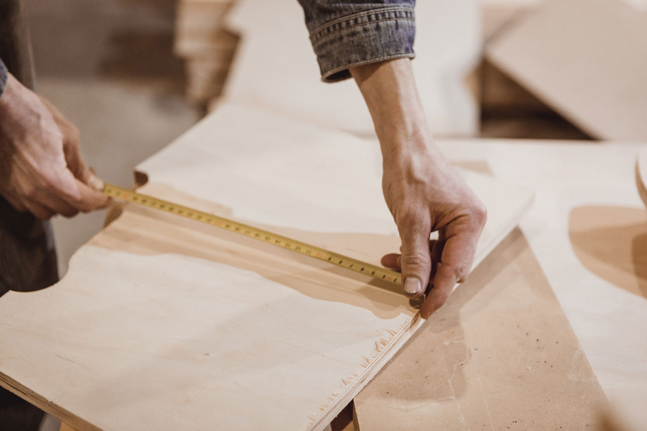 Photo by Olga: Plywood board being measured.